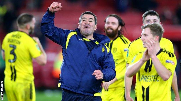Nigel Clough punches the air after Burton Albion reach the semi-finals