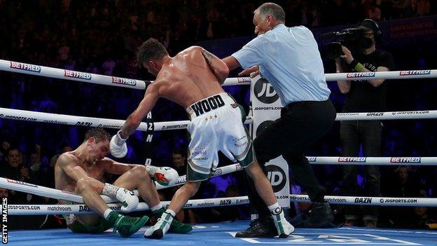 Michael Conlan fell through the ropes after a brutal last-round knockout by Leigh Wood