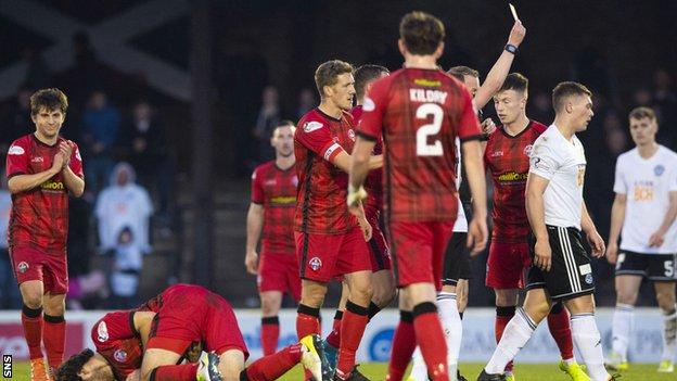 Ayr United's Craig Moore (right) is shown a red card following an altercation with Morton's Gregor Buchanan (left).