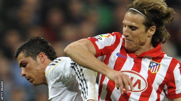 Diego Forlan and Cristiano Ronaldo