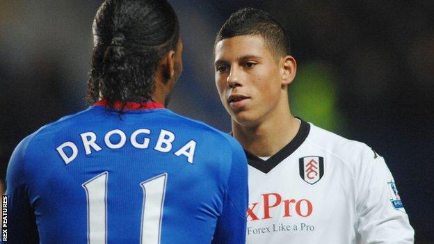 Matthew Briggs (right) shakes hands with Didier Drogba