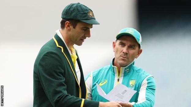 Cummins and Langer during day one of the Third Test match in the Ashes series