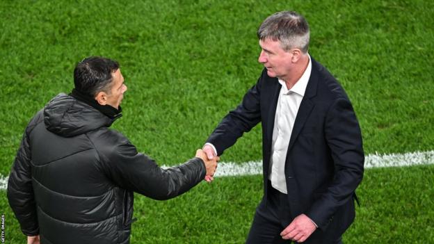 Gus Poyet shakes hands with Stephen Kenny