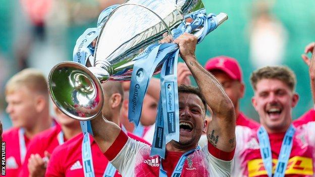 Danny Care holds aloft the Premiership trophy after winning the competition with Harlequins in 2021