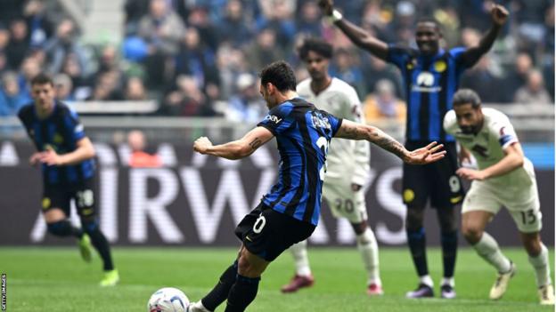 Hakan Calhanoglu scores from the penalty spot for Inter against Torino