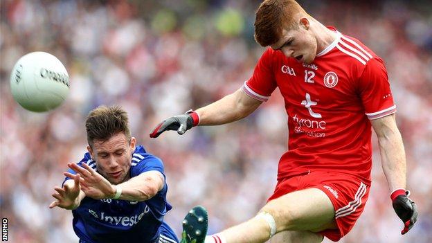 Monaghan's Karl O'Connell attempts to block this shot from Reds Hands forward Cathal McShane