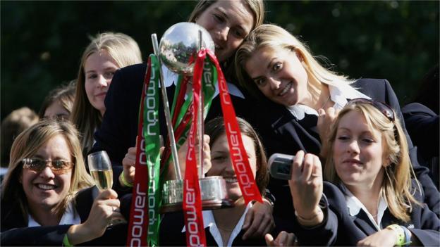 England's women's Ashes winners hold the trophy and take selfies on a bus tour