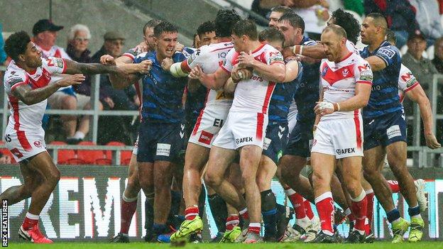 Wigan and St Helens players clash in their Super League meeting at the Totally Wicked Stadium