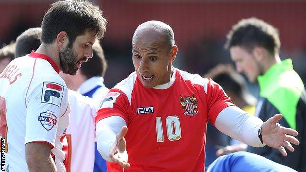 Dino Maamria (right) in discussion with a Stevenage player