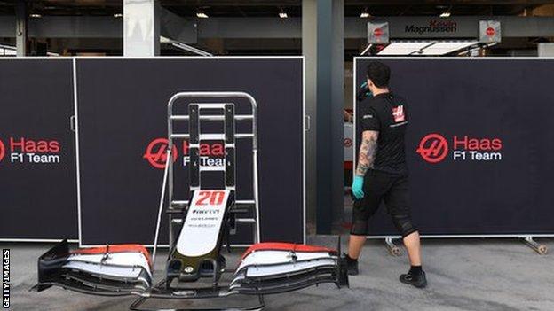 A man walking into the Haas team garage at Albert Park in Melbourne