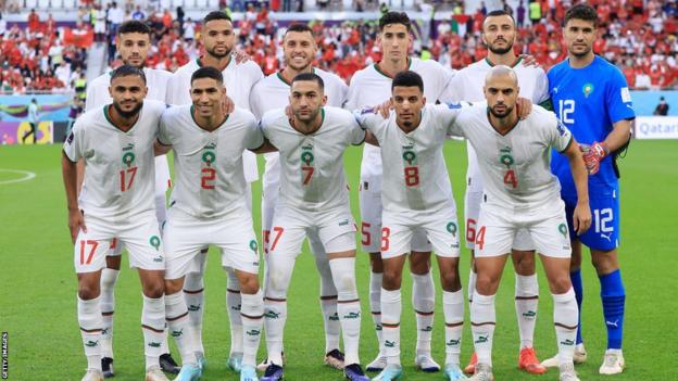 Morocco players line up for team photos before the Belgium match