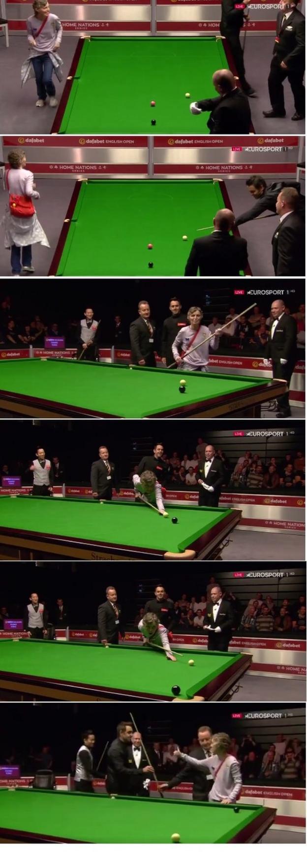Ronnie OSullivan hands cue to table invader to pot the black