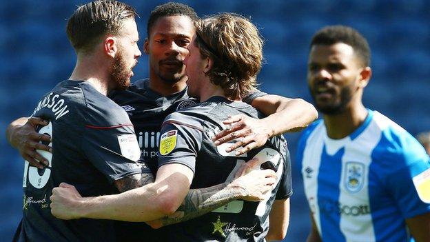 Brentford's Mads Sorensen celebrates scoring with Pontus Jansson and Ethan Pinnock