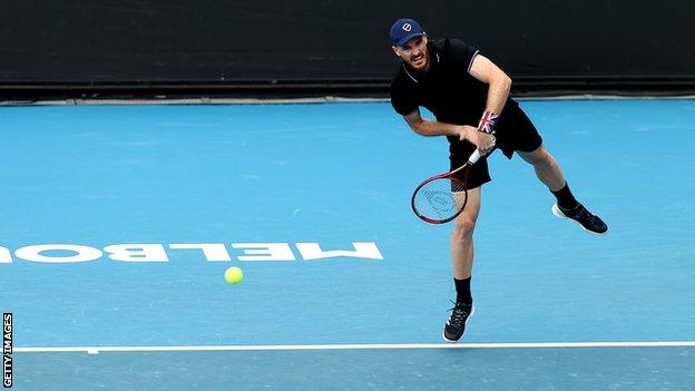 Jamie Murray serves in an Australian Open match