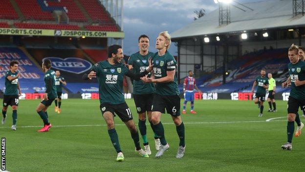 Ben Mee (centre) celebrates with Burnley team-mates