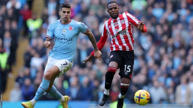 Manchester City's Joao Cancelo heads the ball during the Champions