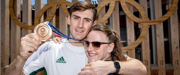 A delighted Aidan Walsh displays his bronze medal with sister Michaela