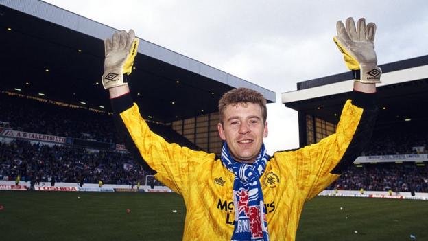 Goalkeeper Andy Goram celebrates on the pitch at Ibrox