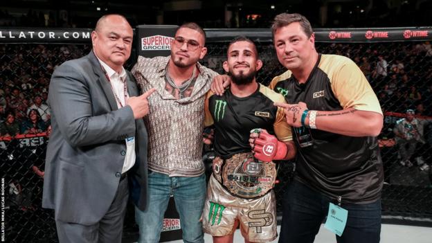 Sergio Pettis celebrates with his squad  aft  beating Patricio 'Pitbull' Freire