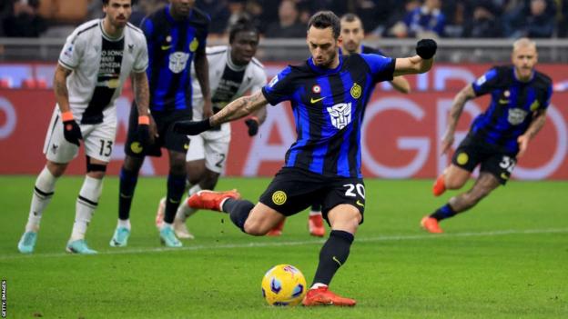 Hakan Calhanoglu scores a penalty for Inter versus Udinese
