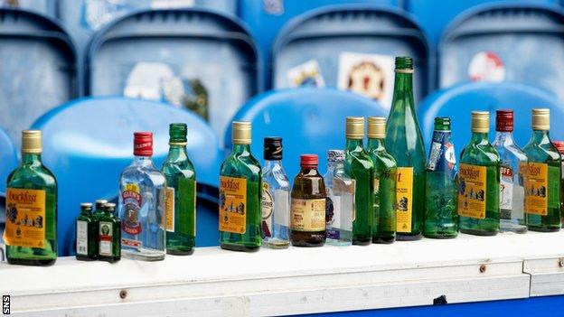 Discarded bottles at Ibrox after the match