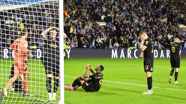 Peterborough united players left dejected