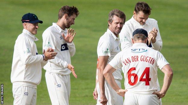 Glamorgan team-mates applaud Michael Hogan after he claimed his 600th first-class wicket