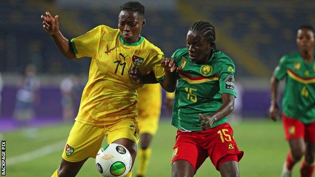 Afi Woedikou of Togo is challenged by Colette Ndzana Fegue of Cameroon
