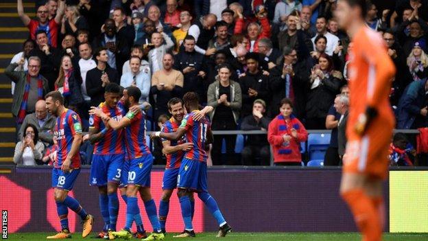 Crystal Palace celebrate scoring their first league goal of the season