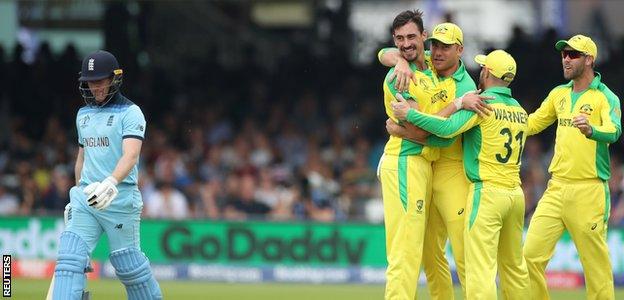 Eoin Morgan walks off after being dismissed by Mitchell Starc at Lord's