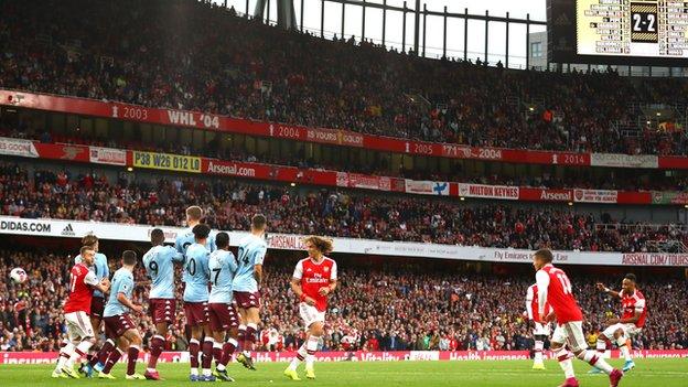 Pierre-Emerick Aubameyang scores a free-kick for Arsenal against Aston Villa