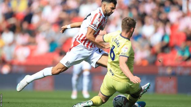 Liam Lindsay tackles Stoke's Mehdi Leris as Preston win at Stoke
