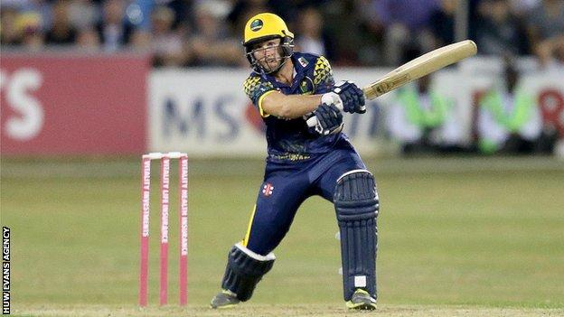 Chris Cooke of Glamorgan hits a huge 6 on the way to victory