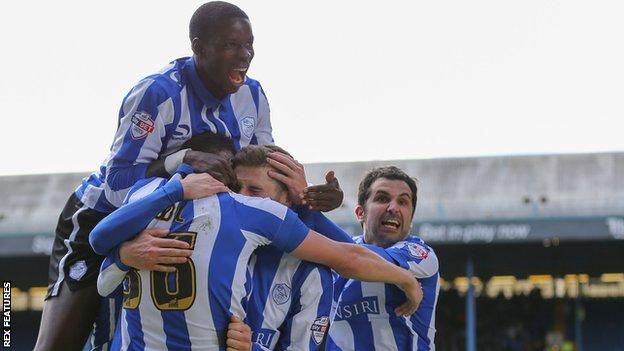 Sheffield Wednesday players celebrate Gary Hooper's opening goal against Cardiff