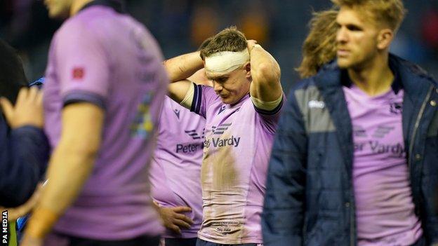 Scotland’s Darcy Graham with his hands on his head at full time after the Autumn International match at BT Murrayfield Stadium, Edinburgh