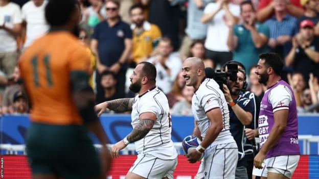 Luka Ivanishvili celebrates his try for Georgia