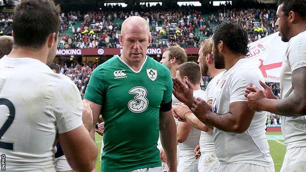 Dejected Ireland captain Paul O'Connell walks off the pitch at Twickenham after defeat by England