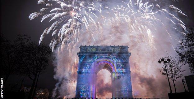 Fireworks explode over the Arc de Triomphe to celebrate Paris' 2024 Olympic Games bid