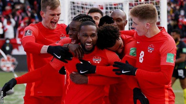 Canada's Junior Hoilett celebrates scoring their third goal with teammates