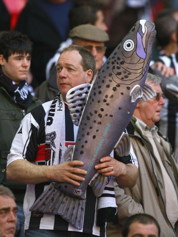 A Grimsby Town fan with an inflatable 'Harry Haddock' during the club's Johnstone's Paint Trophy final against MK Dons at Wembley in 2008