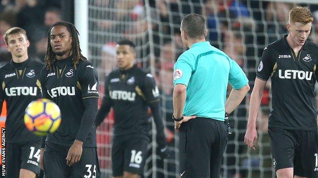 Swansea players were dejected as they lost 5-0 at Liverpool in December