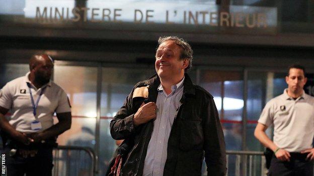 Michel Platini leaves a police station in Nanterre where he was questioned