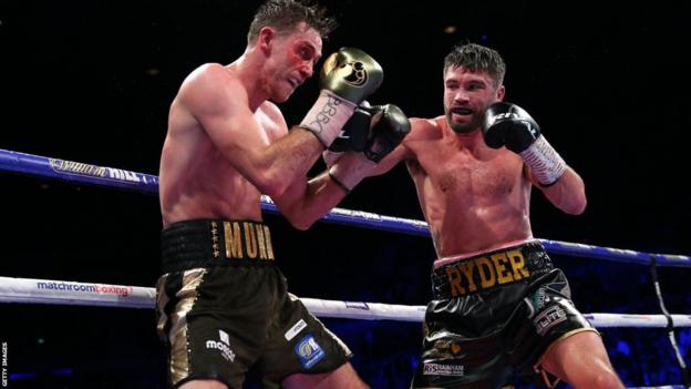 John Ryder has Callum Smith backed up on the ropes in their 2019 contest