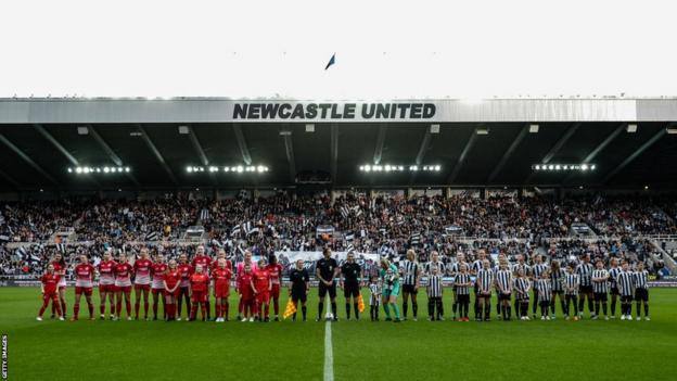 Newcastle and Barnsley players line up at St. James' Park prior to their FA Cup tie