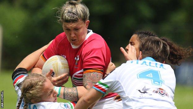 Wales' Lauren Aitken on the charge against Italy