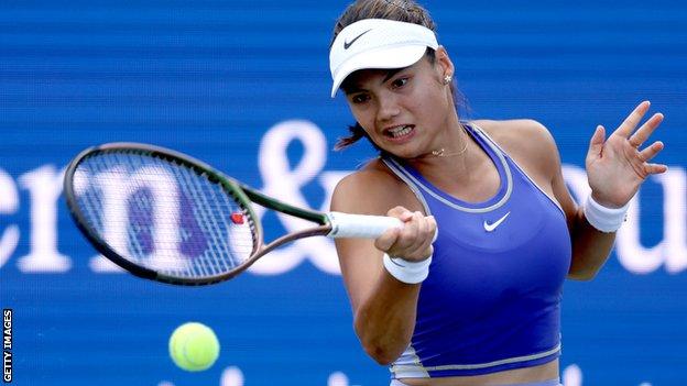 Emma Raducanu hits a return against Victoria Azarenka in the Western and Southern Open in Cincinnati