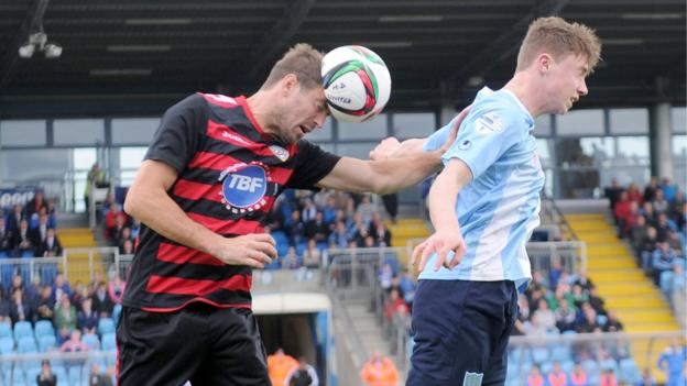 Steven Douglas and Matthew Shevlin in action as Coleraine defeat derby rivals Ballymena United 2-0 at the Showgrounds