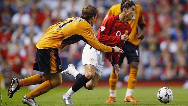 Cristiano Ronaldo gets past Lee Naylor of Wolves in a game in 2003