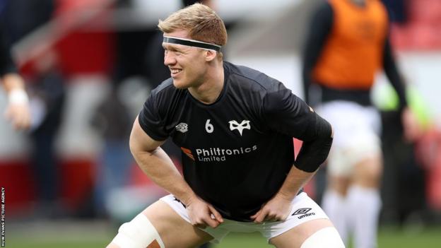 Ospreys' Sam Cross stretches off