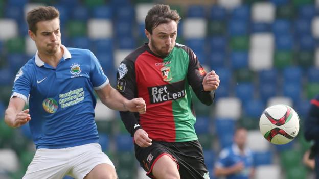 Linfield defender Matthew Clarke in action against Fra McCaffrey of Glentoran during the 1-1 draw at Windsor Park